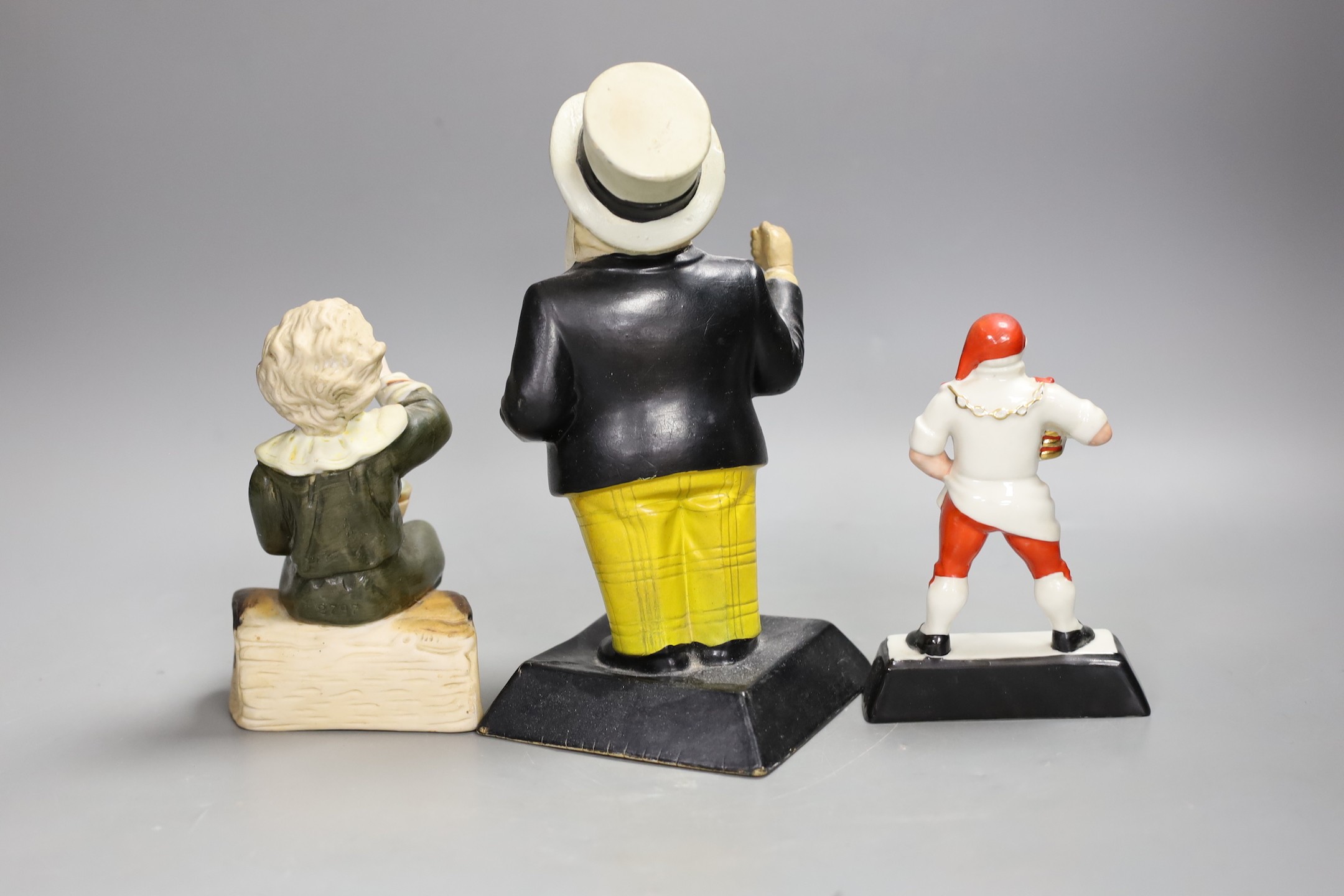 A Younger's Tartan keg advertising figure, a Brewmaster figure and a bisque figure. Tallest 22cm